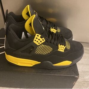 Yellow and Black Jordan 4s